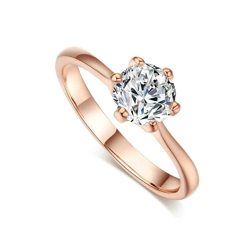 Elegant rose gold and zircon ring with a geometric design and sparkling zircon stones