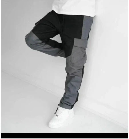 Men's large pocket stitching trousers in black and grey, featuring multiple pockets and a loose fit.