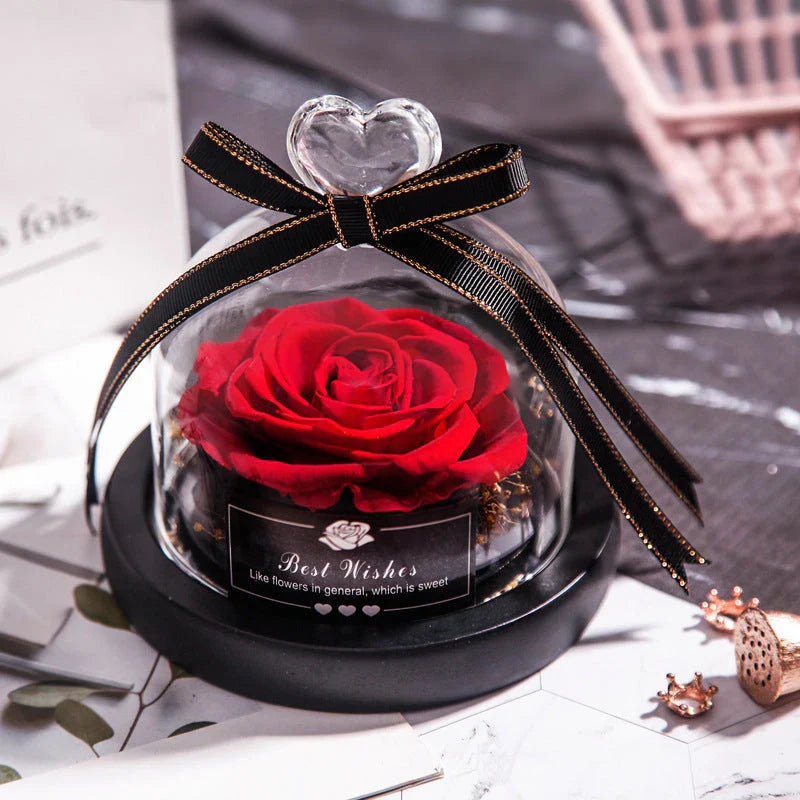 Enchanting Eternal Rose with LED lighting in a glass display, showcasing its timeless beauty and elegant design