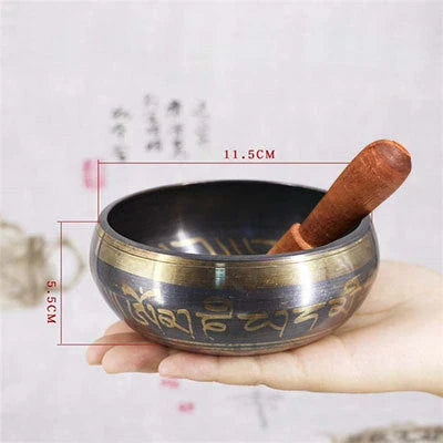 A handcrafted Tibetan singing bowl made of copper, used for meditation and relaxation.