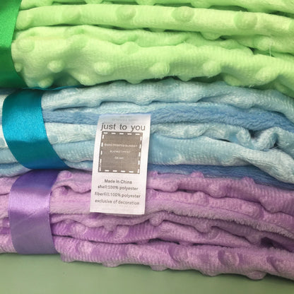 Premium plush baby blanket in various colours, perfect for swaddling, strolling, and creating a cosy nursery environment