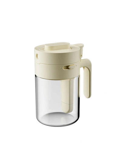 Small glass seasoning jars with lids and built-in spoons for easy measuring and storage