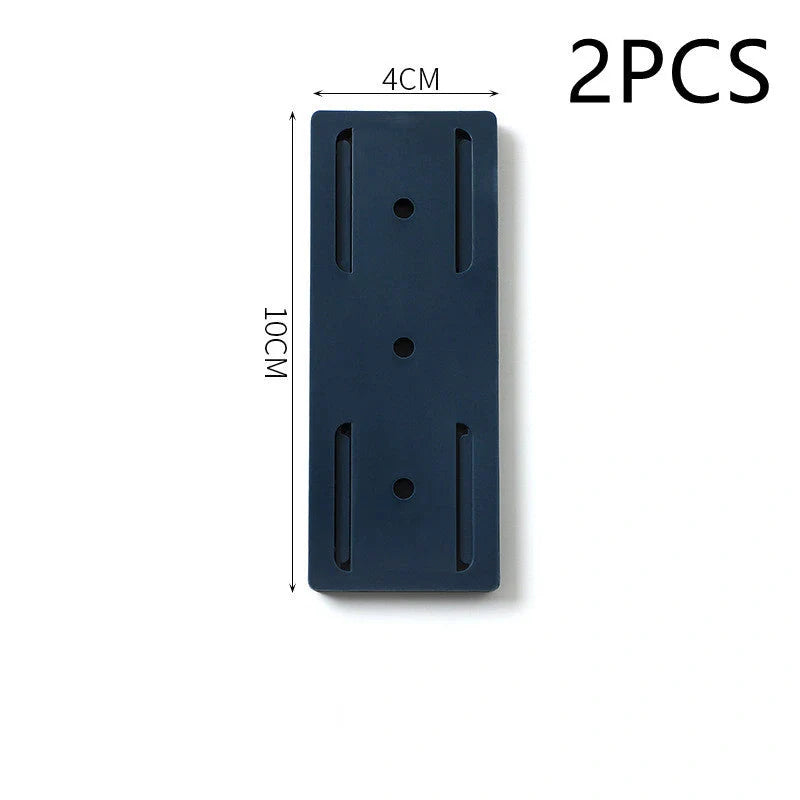 Self-adhesive wall hook in green, blue, white, and pink for cable organisation