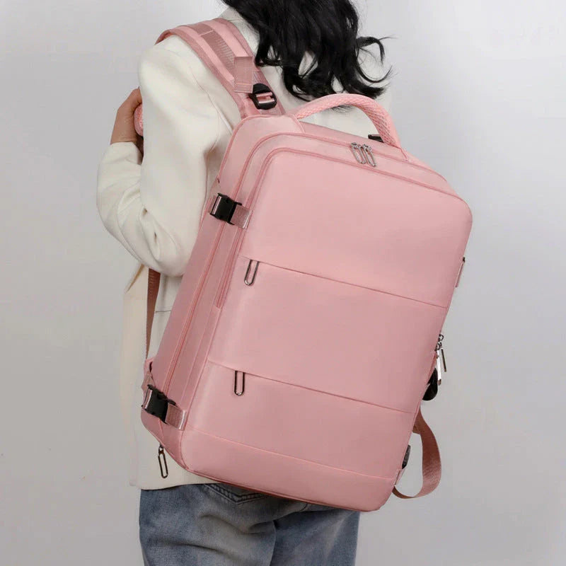Spacious women's travel backpack with dry and wet compartments, waterproof construction, and comfortable air-cushioned harness