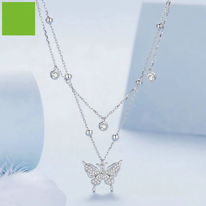 A stunning silver double-layer necklace with a captivating butterfly design and delicate fringed detailing