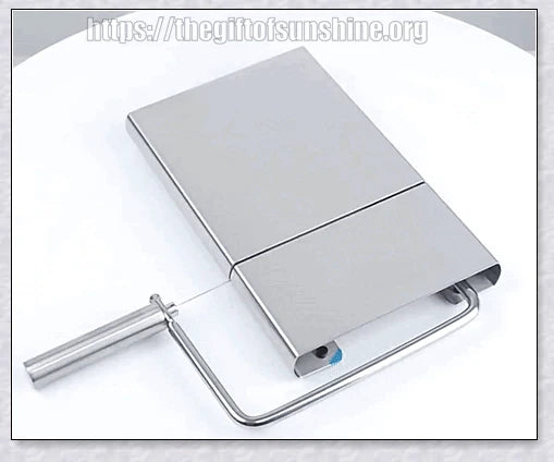 Stainless steel cheese slicer cutter with adjustable thickness and non-slip handle, perfect for slicing soft and hard cheeses