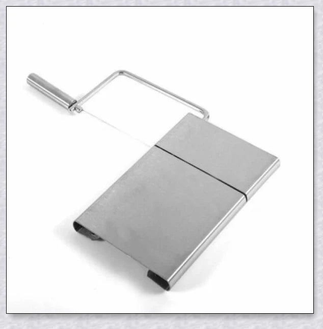Stainless steel cheese slicer cutter with adjustable thickness and non-slip handle, perfect for slicing soft and hard cheeses