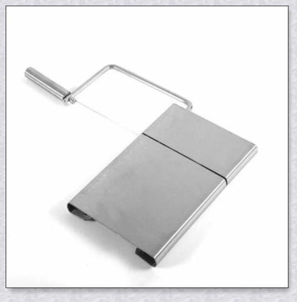 Stainless steel cheese slicer cutter with adjustable thickness and non-slip handle, perfect for slicing soft and hard cheeses