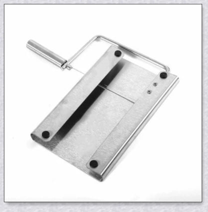 Stainless steel cheese slicer cutter with adjustable thickness and non-slip handle, perfect for slicing soft and hard cheeses