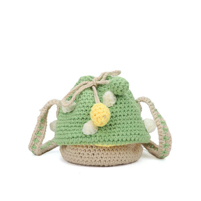 A hand-knitted wool handbag in a classic bucket shape and mini size, featuring premium cotton and linen materials