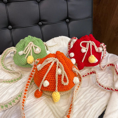 A hand-knitted wool handbag in a classic bucket shape and mini size, featuring premium cotton and linen materials