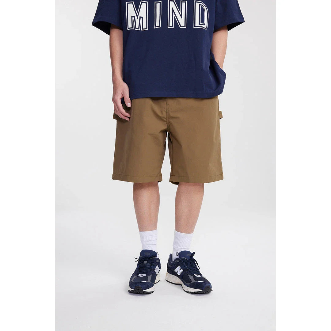 Japanese-inspired retro cargo shorts in khaki and black colours, featuring a loose, straight-leg fit and generous pockets for versatile style and comfort.