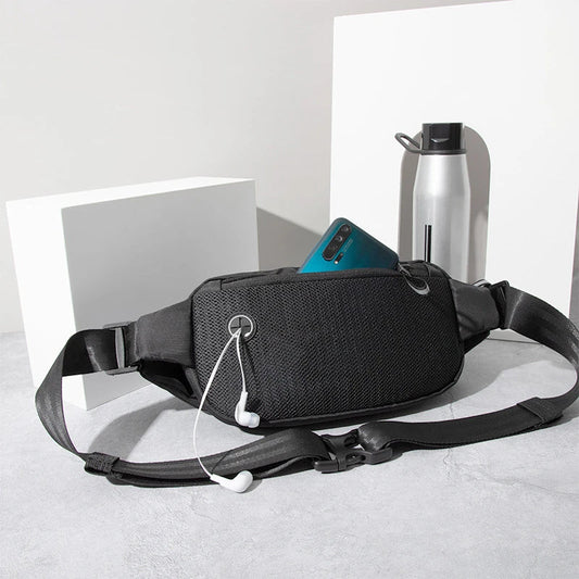 A black nylon crossbody bag with multiple pockets and an adjustable strap, designed for active lifestyles and outdoor adventures.