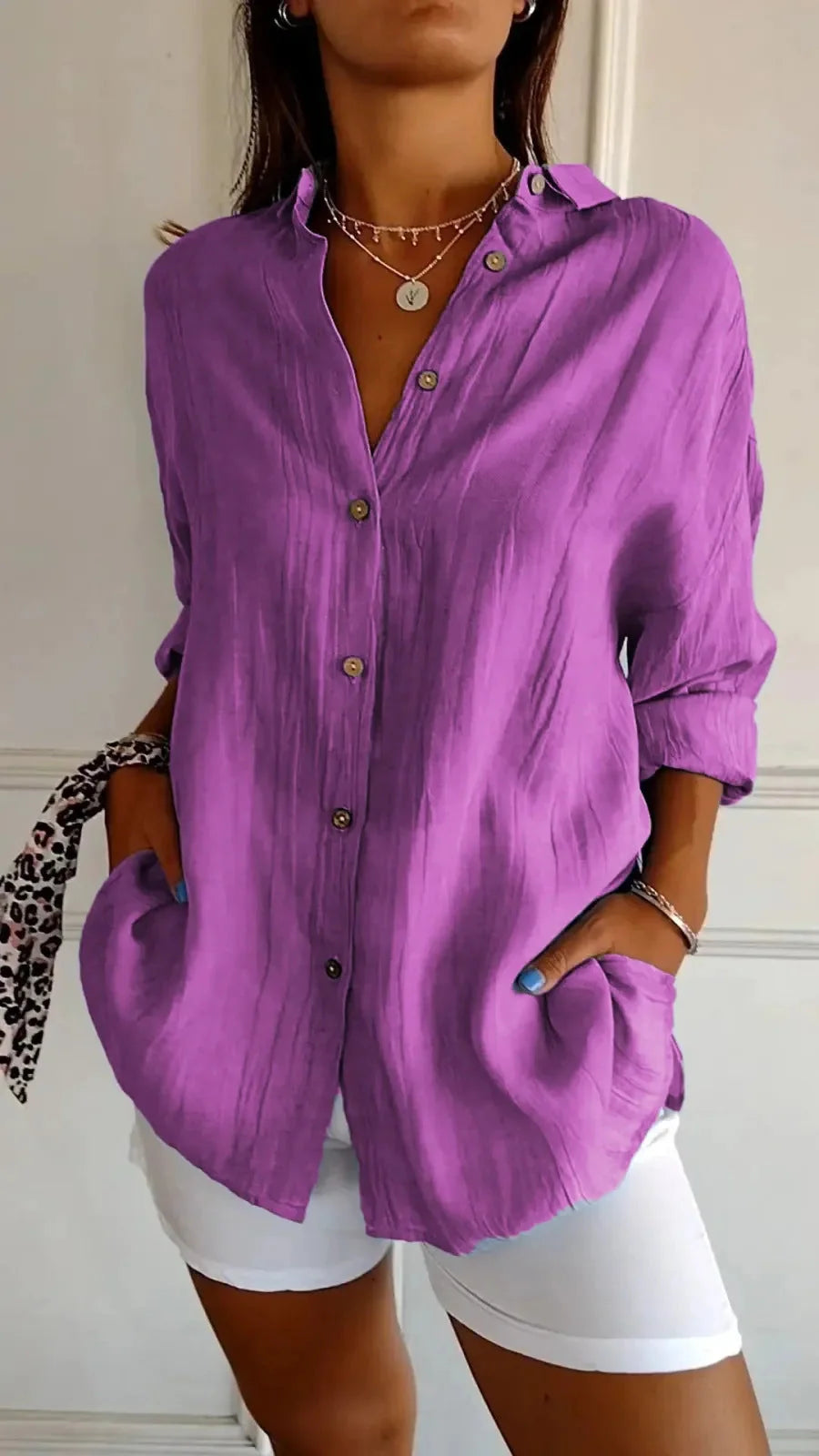 A stylish long-sleeved shirt with a pleated design, available in a variety of colours to suit any occasion.