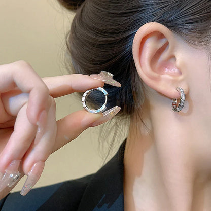 Elegant sterling silver drop earrings featuring sparkling zircon gemstones in a modern geometric design
