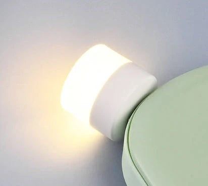 Compact USB LED night light with soft glow for reading and sleep