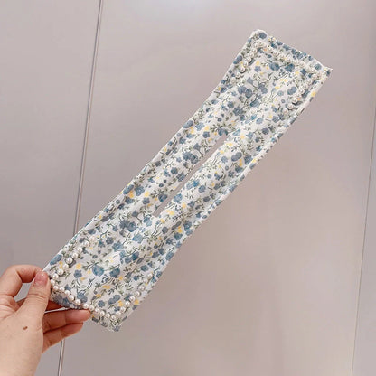 Women's elegant cloth headband with diamond and pearl accents for stylish hairstyles