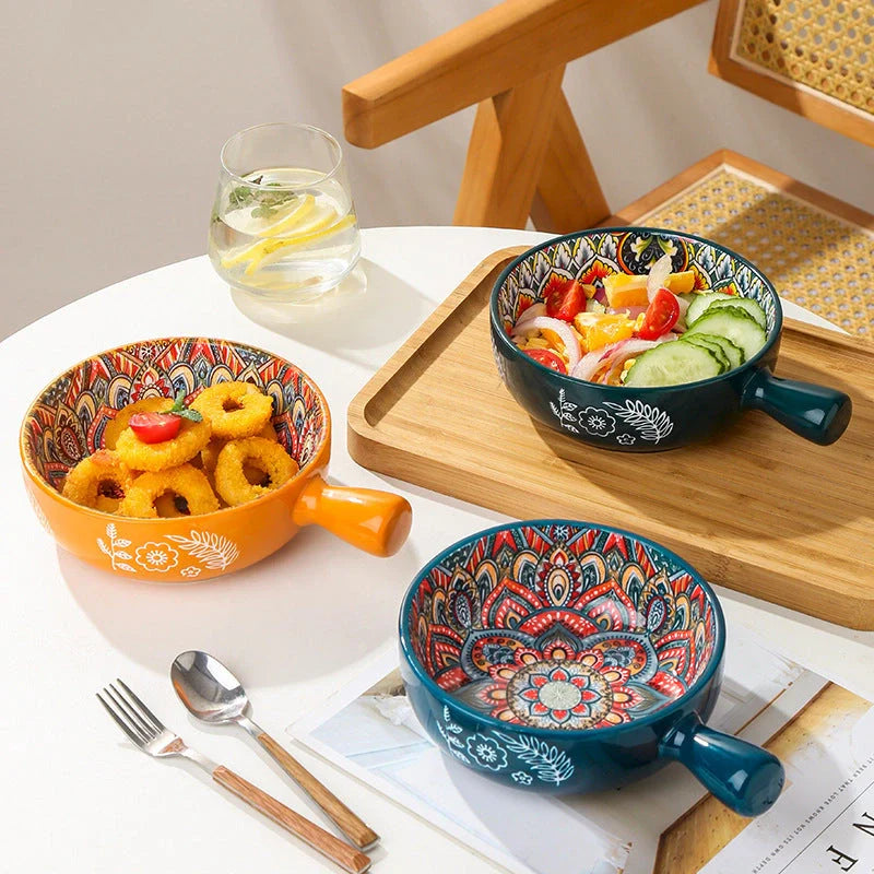 Set of elegant ceramic dessert bowls featuring hand-painted floral patterns in blue, red, and green glazes