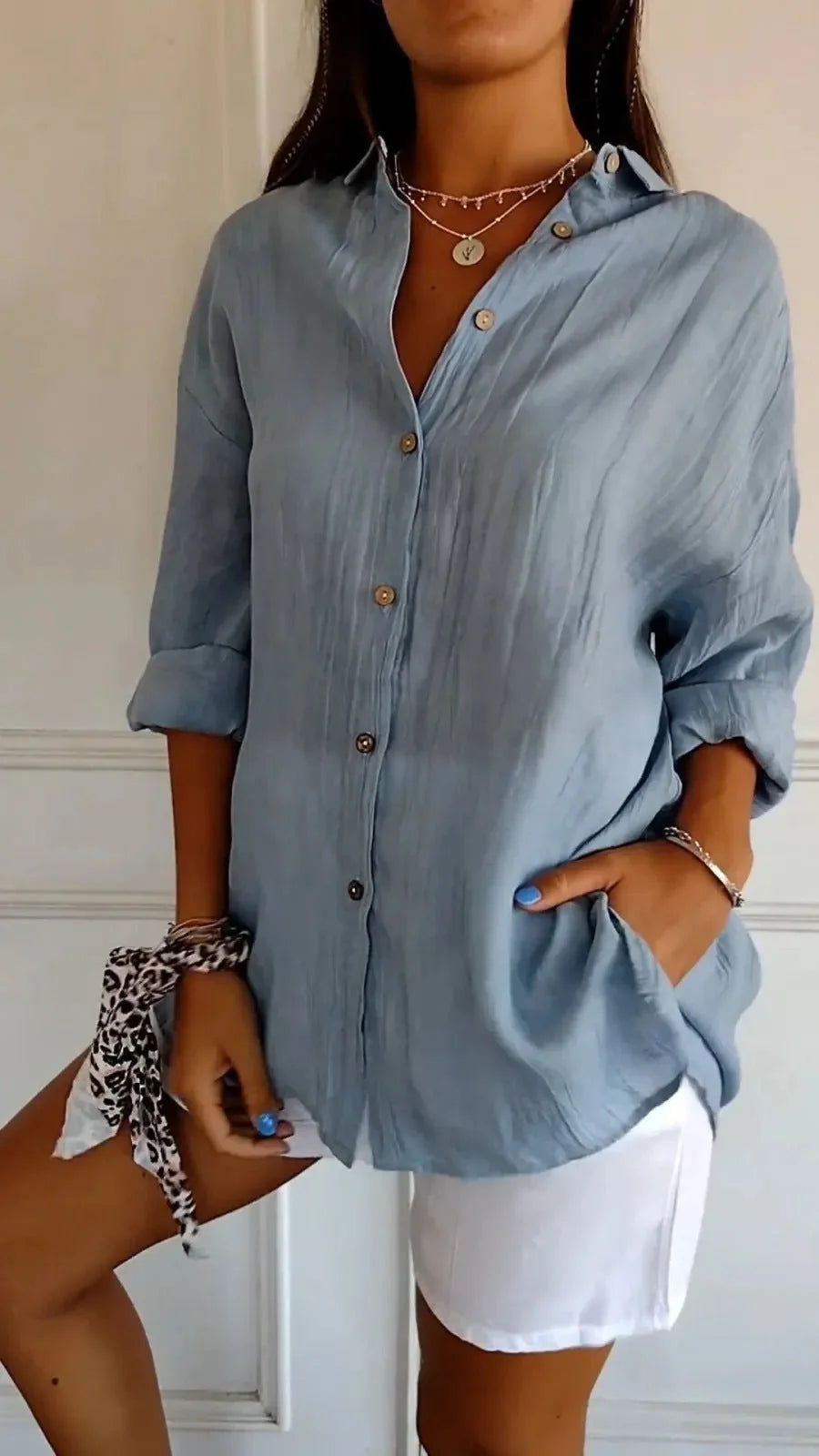 A stylish long-sleeved shirt with a pleated design, available in a variety of colours to suit any occasion.