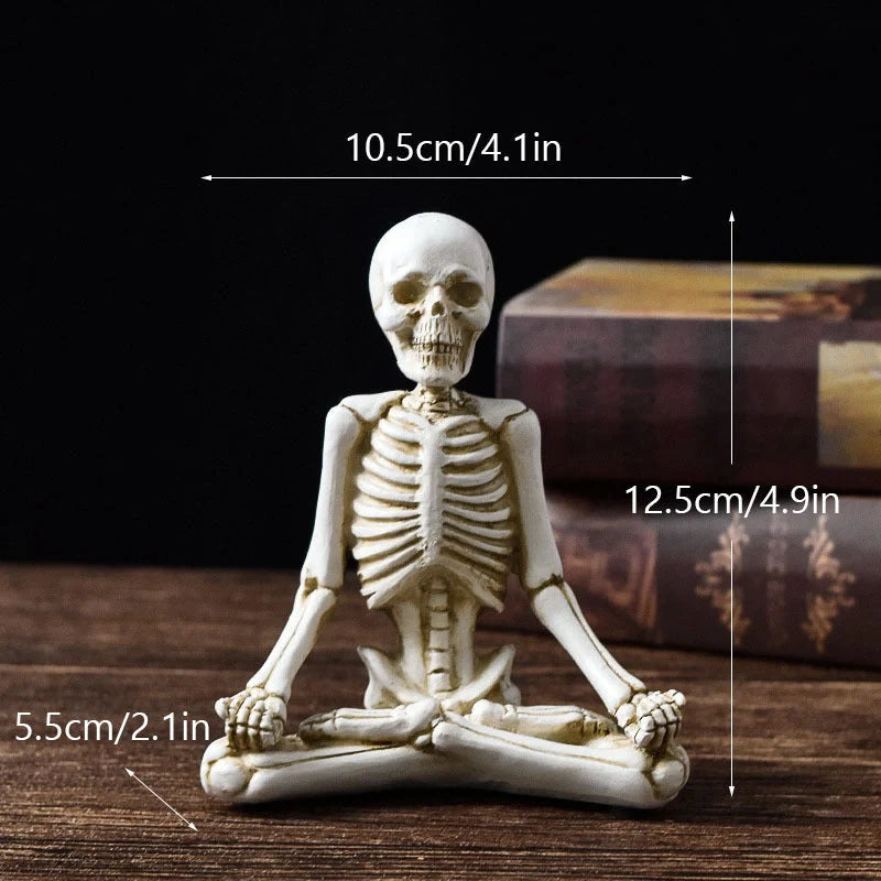 Haunting Halloween desktop ornaments, featuring intricate resin skulls and skeletons in black and vintage white finishes