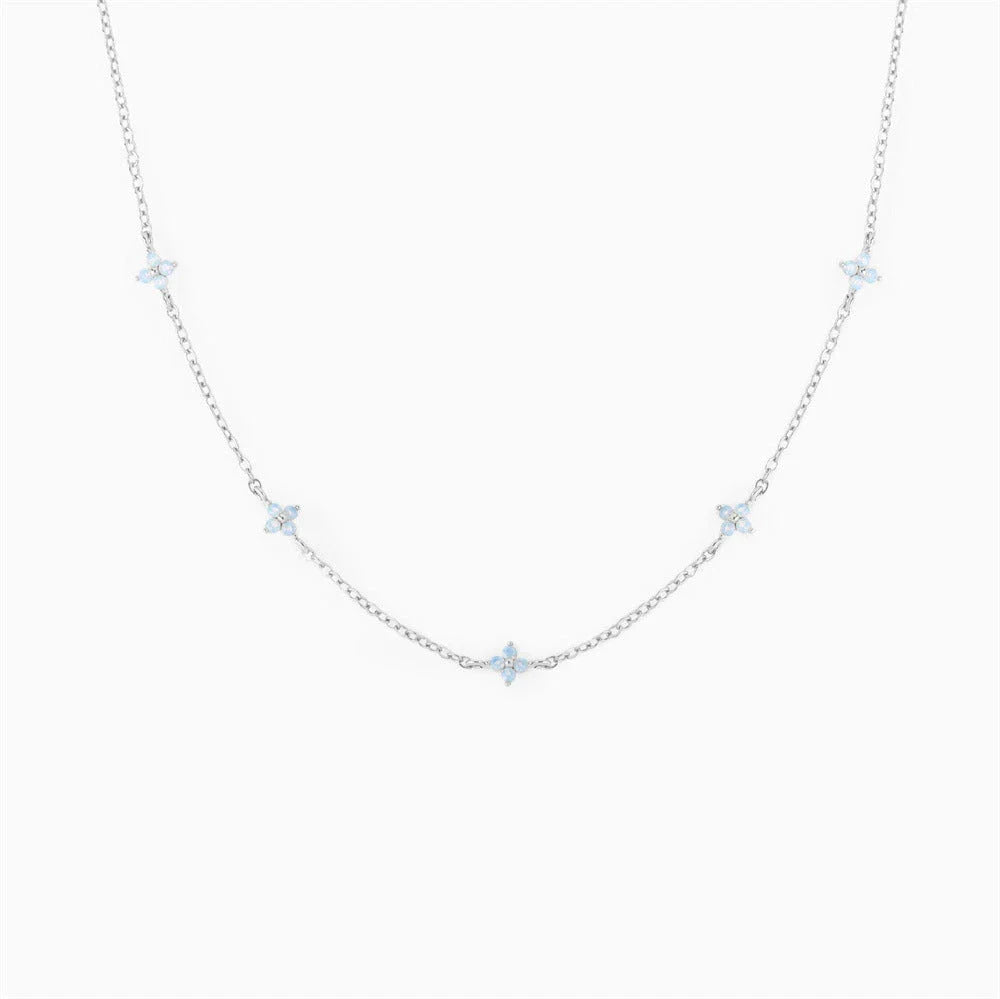 Elegant floral statement necklace in various color options, including golden blue, silver blue, golden green, and silver green, with an adjustable chain and high-quality construction.