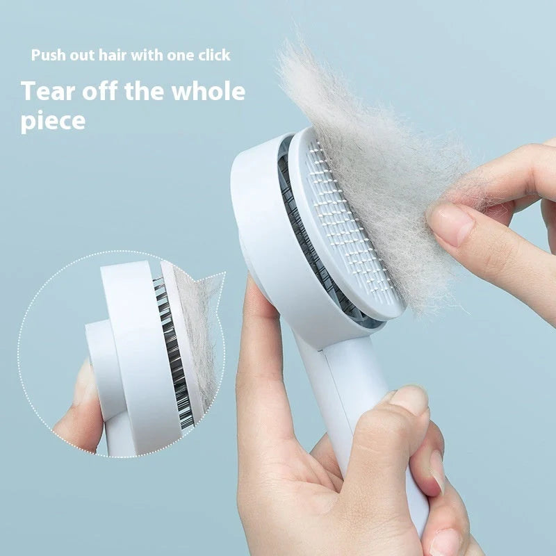 Self-cleaning pet grooming comb with stainless steel needles in blue, pink, and white