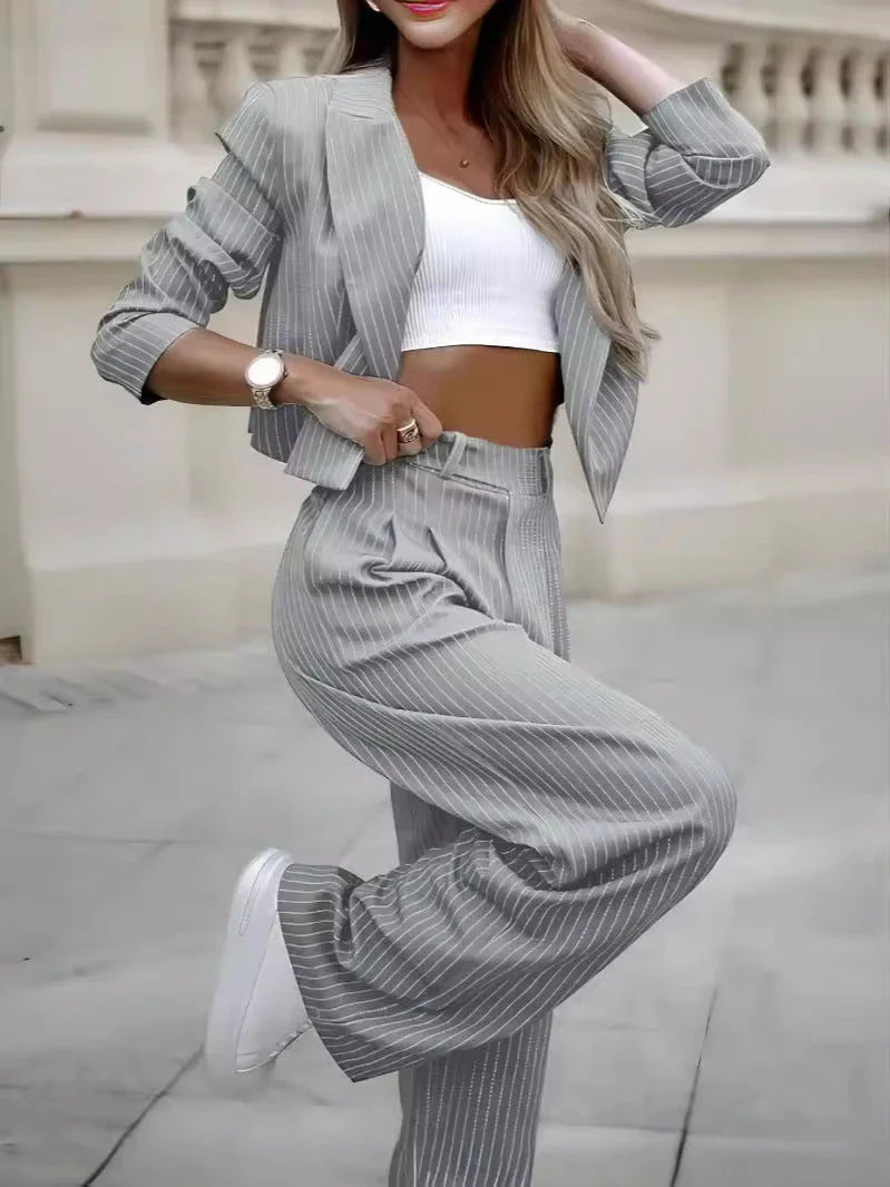 Fashionable striped suit sets featuring cropped tops and straight-leg pants in various color options