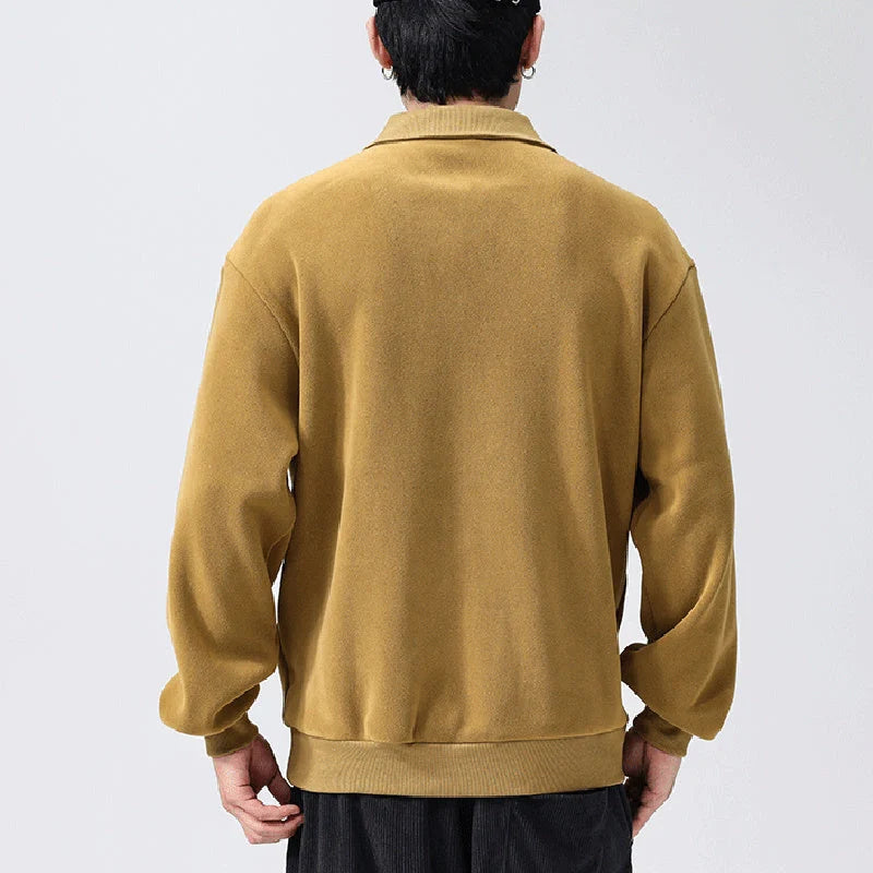Premium fleece half-zip hoodie in black, haze green, and apricot yellow colours, featuring a tailored design and ribbed details for a refined look.