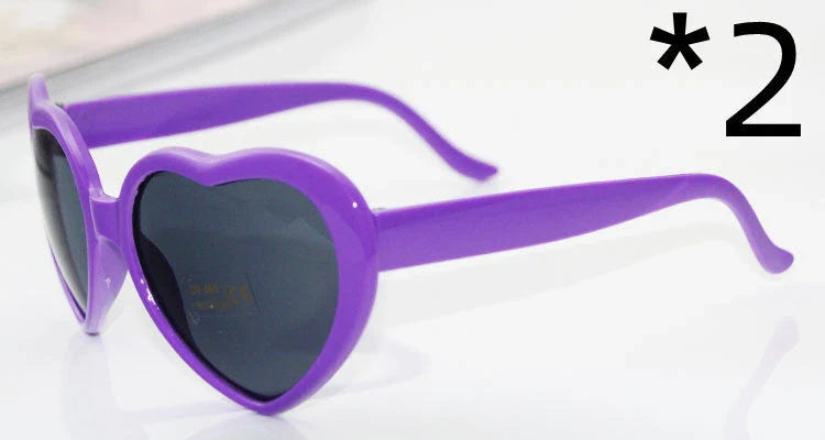 Stylish heart-shaped sunglasses with unique lens design that transforms light into enchanting special effects