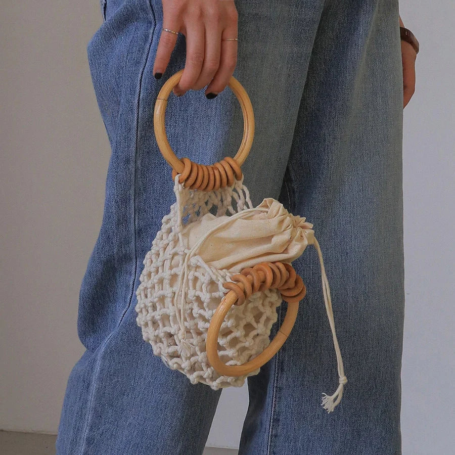 Stylish woven beach bag with wooden handle, perfect for summer outings
