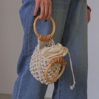 Stylish woven beach bag with wooden handle, perfect for summer outings