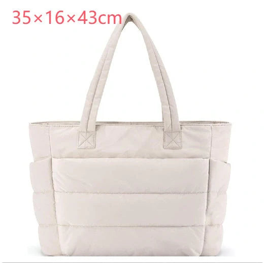 Premium cotton handbag with spacious design, secure zip-top closure, and thoughtful interior organisation for daily use
