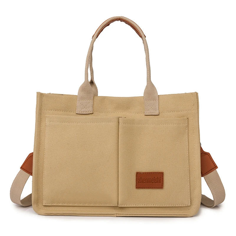 Stylish and durable canvas tote bag with multiple pockets for everyday use