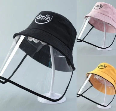Child wearing anti-spitting protective hat with transparent bezel