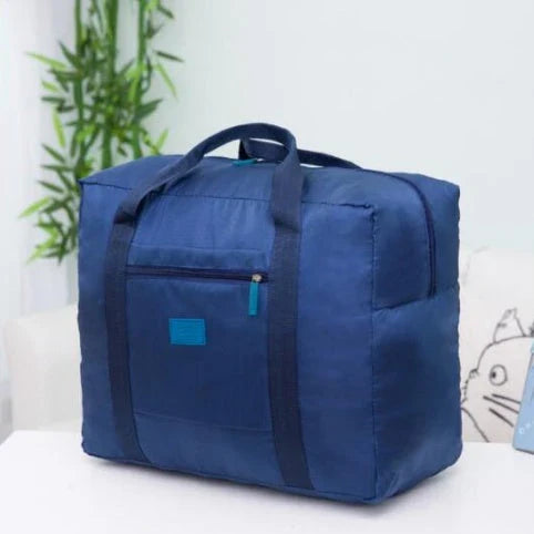 Foldable nylon travel holdall in various colours, including black, orange, green, and red