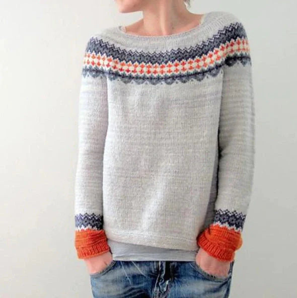 A stylish loose-fit knit jumper with a variety of colourful patterns and designs