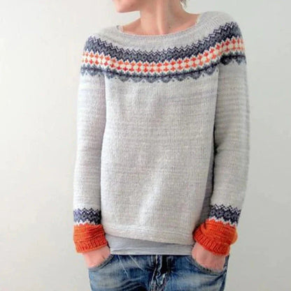 A stylish loose-fit knit jumper with a variety of colourful patterns and designs