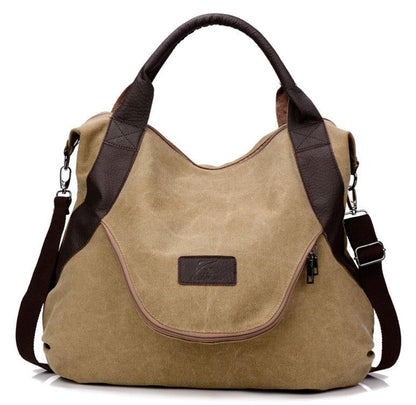 Stylish and versatile canvas shoulder bag with premium brass hardware and thoughtful interior organisation