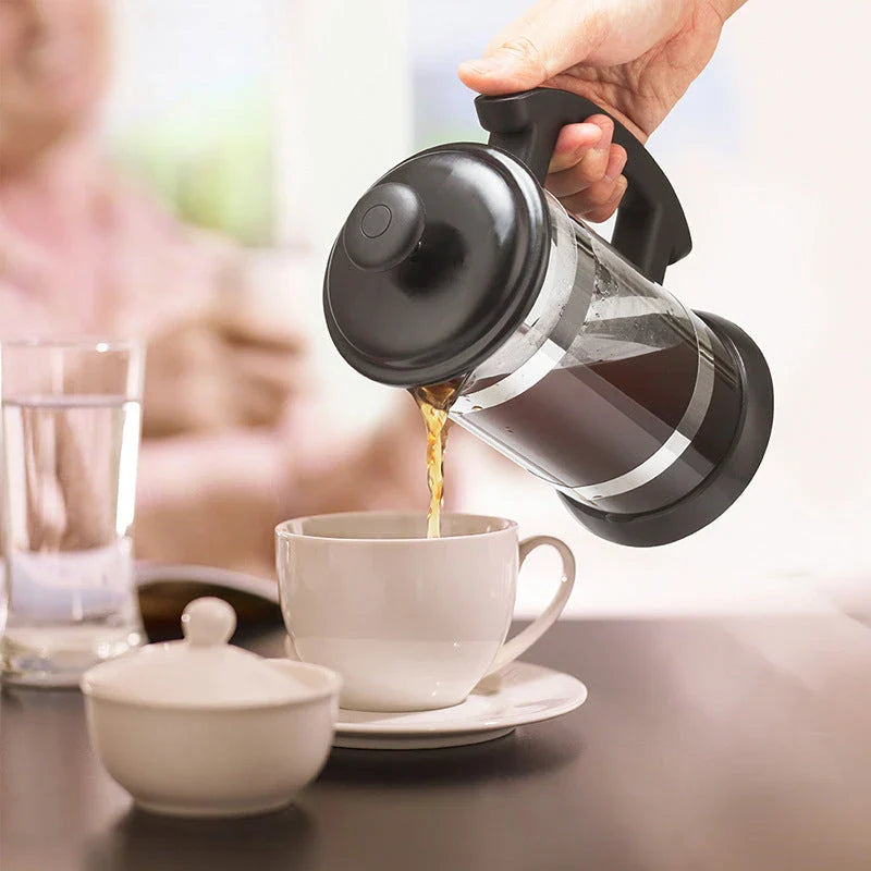 Elegant French press coffee maker in glass and stainless steel, perfect for brewing rich, aromatic coffee at home