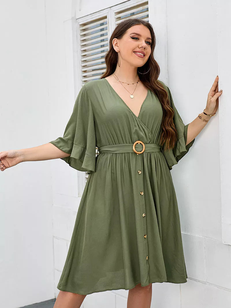 Plus-size green party skirt with V-neck and ruffle sleeves