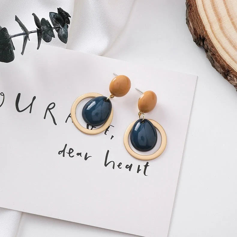 Elegant candy drop earrings in pink, green, and blue shades, showcasing a stylish and durable alloy design