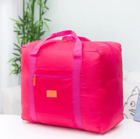 Foldable nylon travel holdall in various colours, including black, orange, green, and red