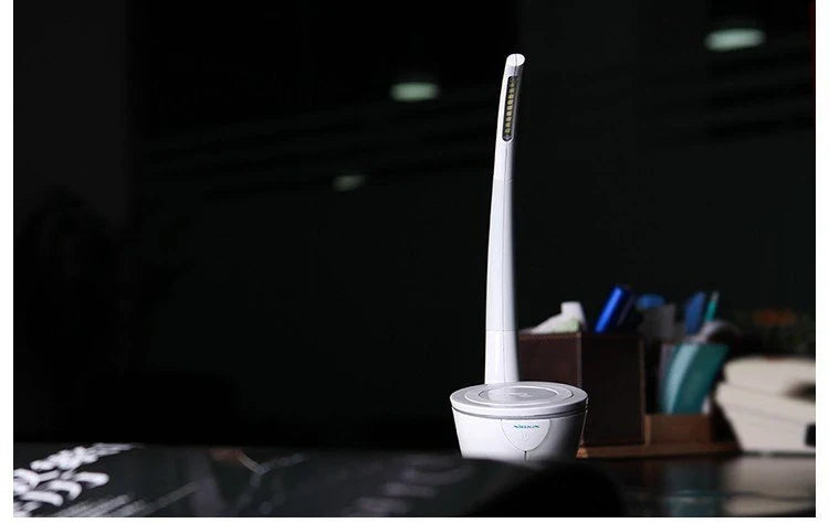 Stylish wireless charging table lamp with adjustable brightness and modern, minimalist design