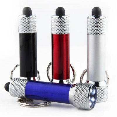 Compact LED keychain torch in four colours for emergencies and camping