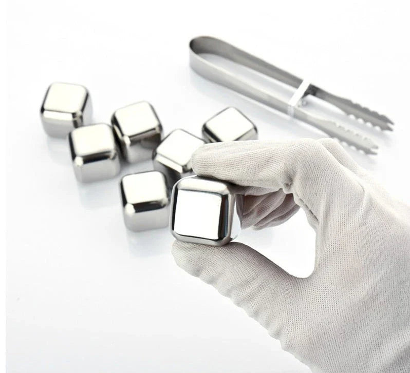 Premium stainless steel whisky chilling stones set in various shapes and sizes, including square, circular, heart, and diamond-shaped stones