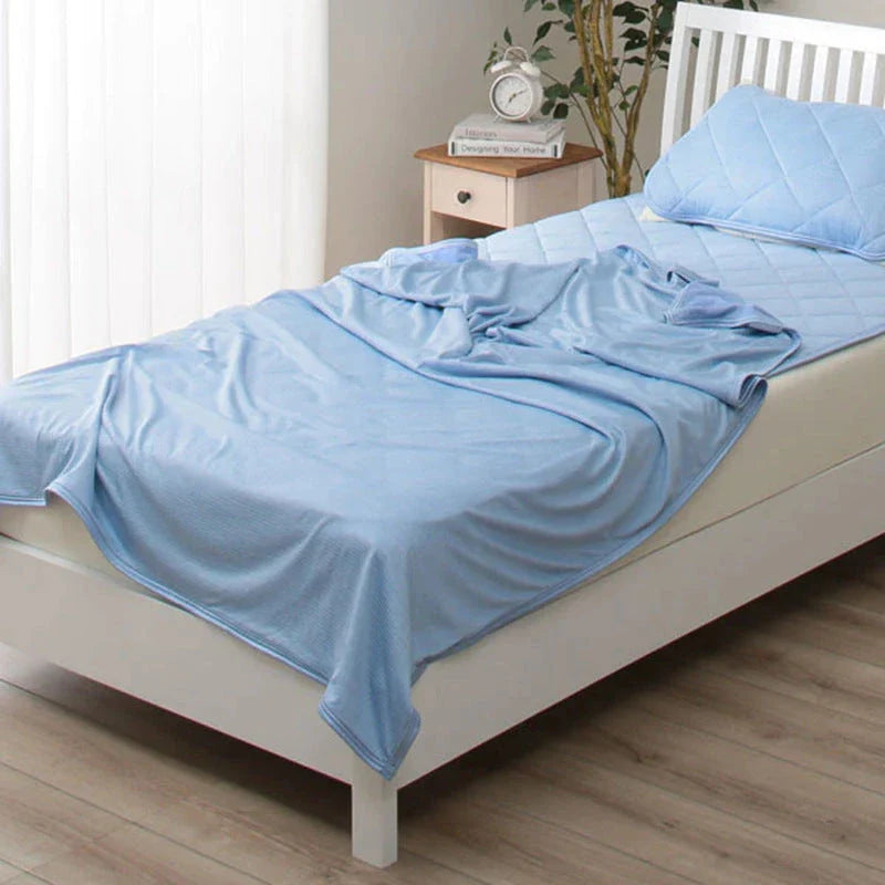 A premium polyester cooling blanket with innovative Japanese cooling fibers that provides refreshing temperature regulation for a comfortable sleep experience