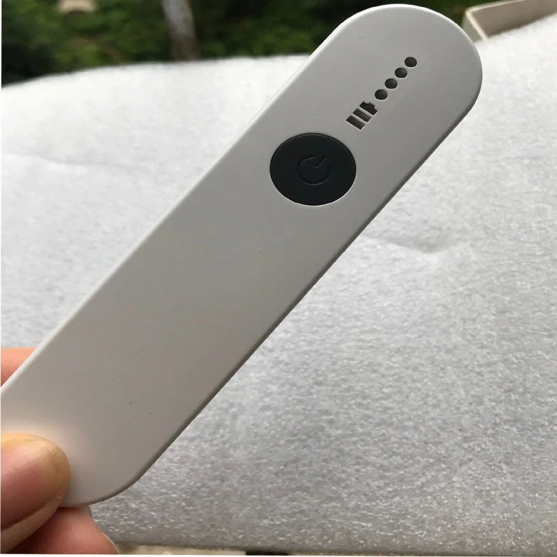 Portable UV disinfection lamp sterilizing a mobile phone
