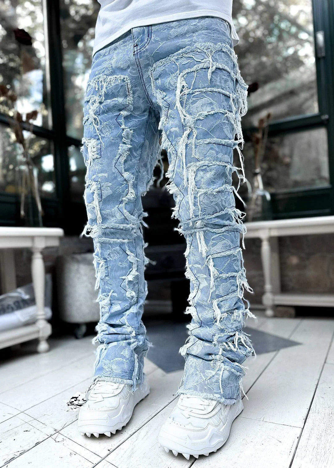 Stylish patched jeans with tight fit and stacked leg design in a variety of fashionable colors