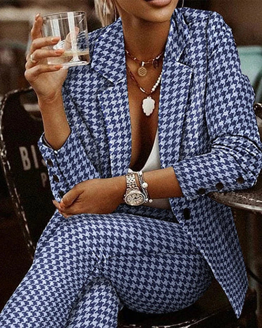 Stylish plaid suit set for modern women, featuring a tailored blazer and complementary pants in black and white or blue color options.