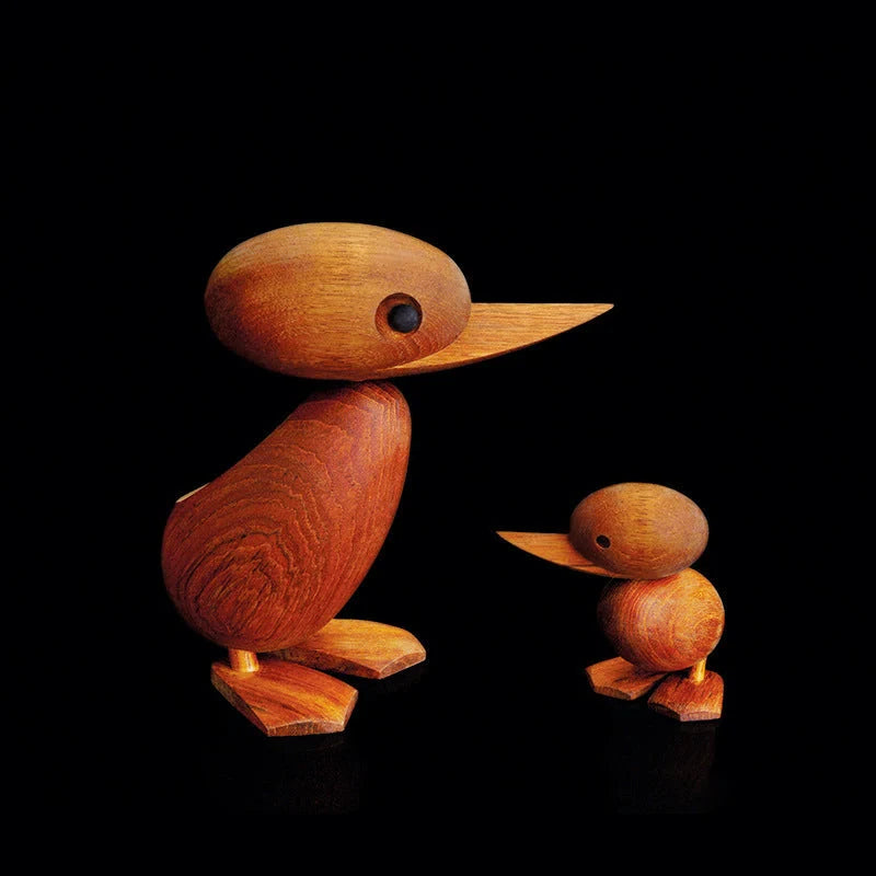 Handcrafted teak wood duck toy in duck yellow, available in large and small sizes